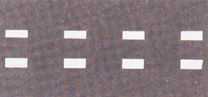 خطوط متقاطعة متوازية: خطوط مسلك في شارع ذو ثلاثة مسالك أو أكثر